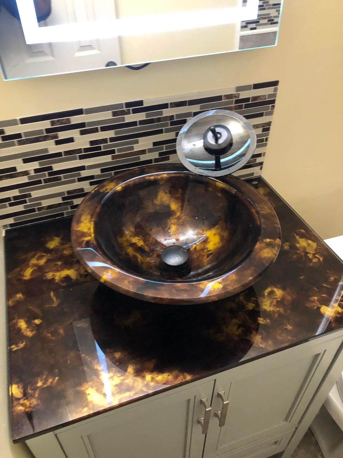 Bathroom vanity with vessel sink and updated fixtures