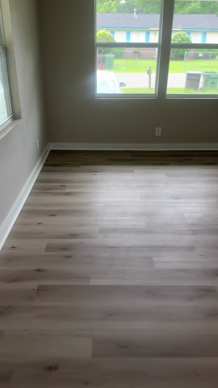 Finished bedroom with new plank flooring
