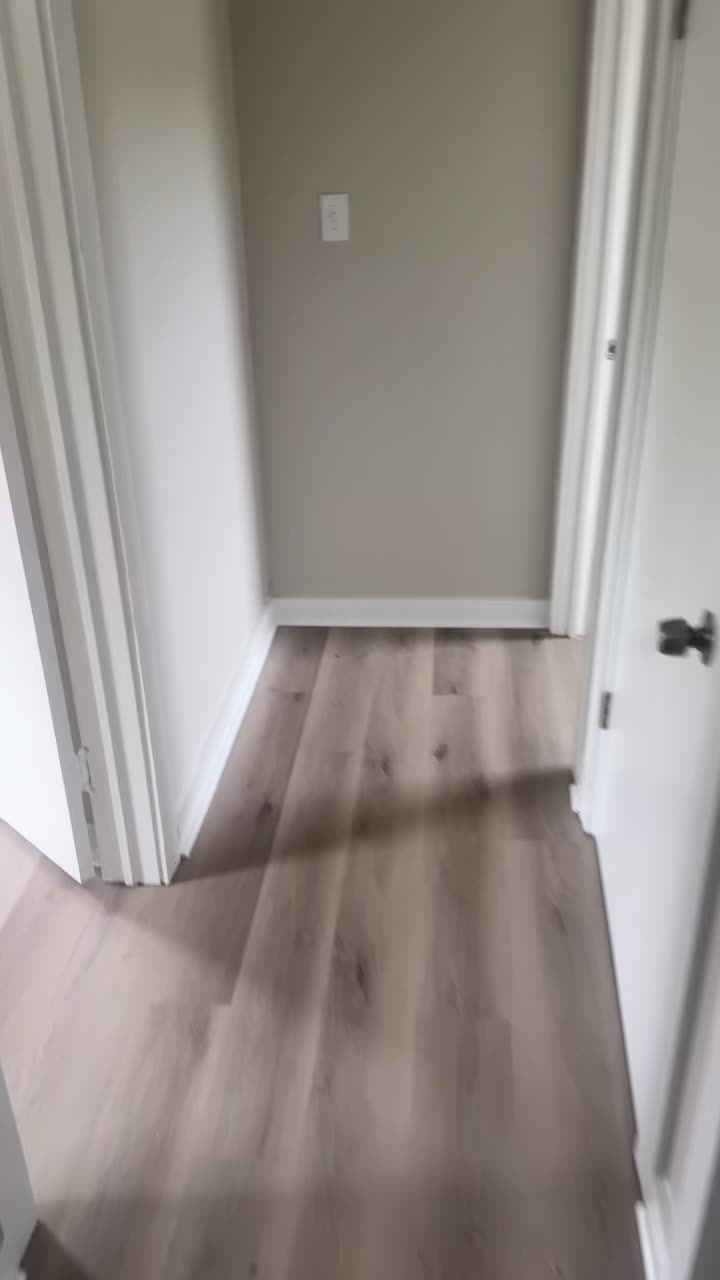Finished hallway with new plank flooring