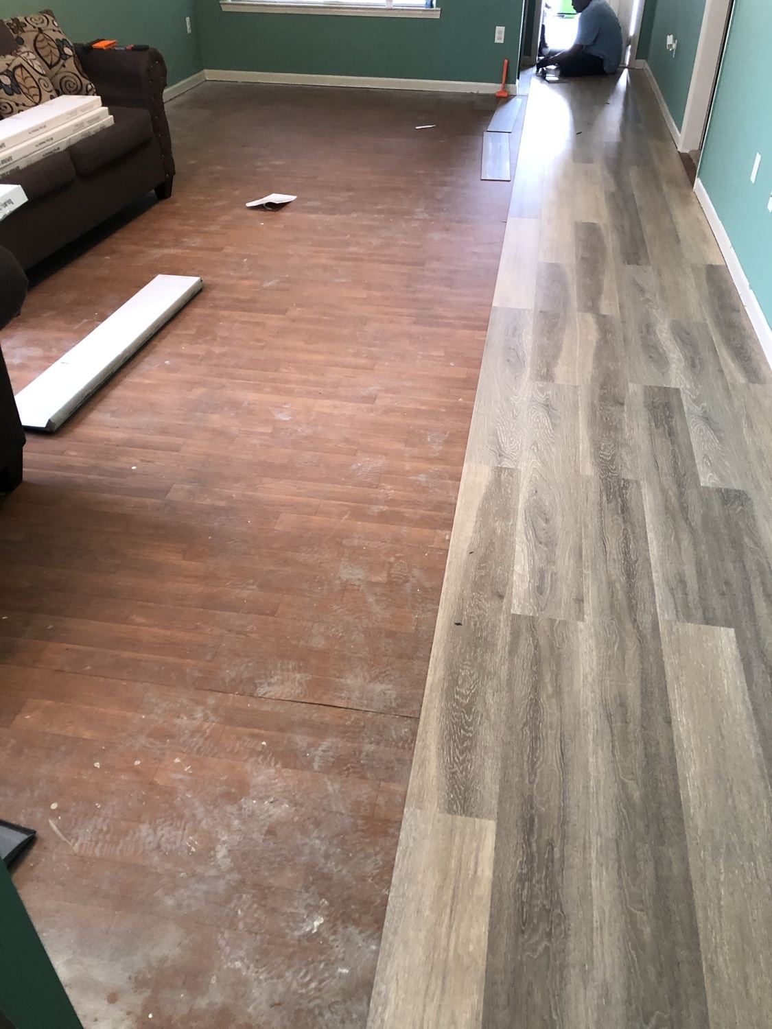 Plank flooring installation in progress