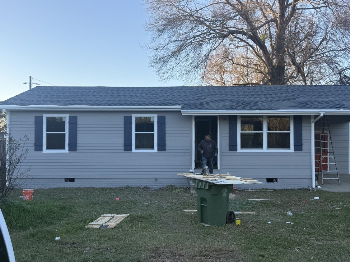 Finished full exterior renovation with new roof, siding, and shutters