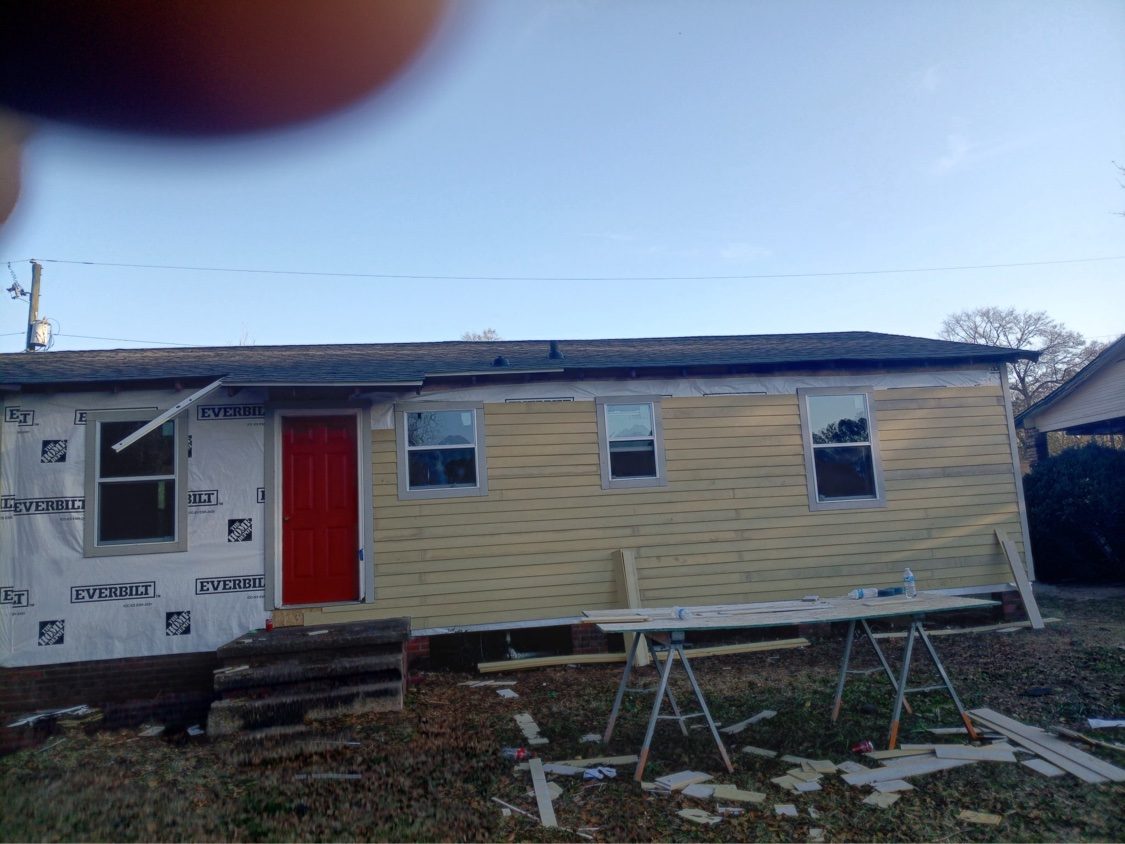 New siding going up over house wrap
