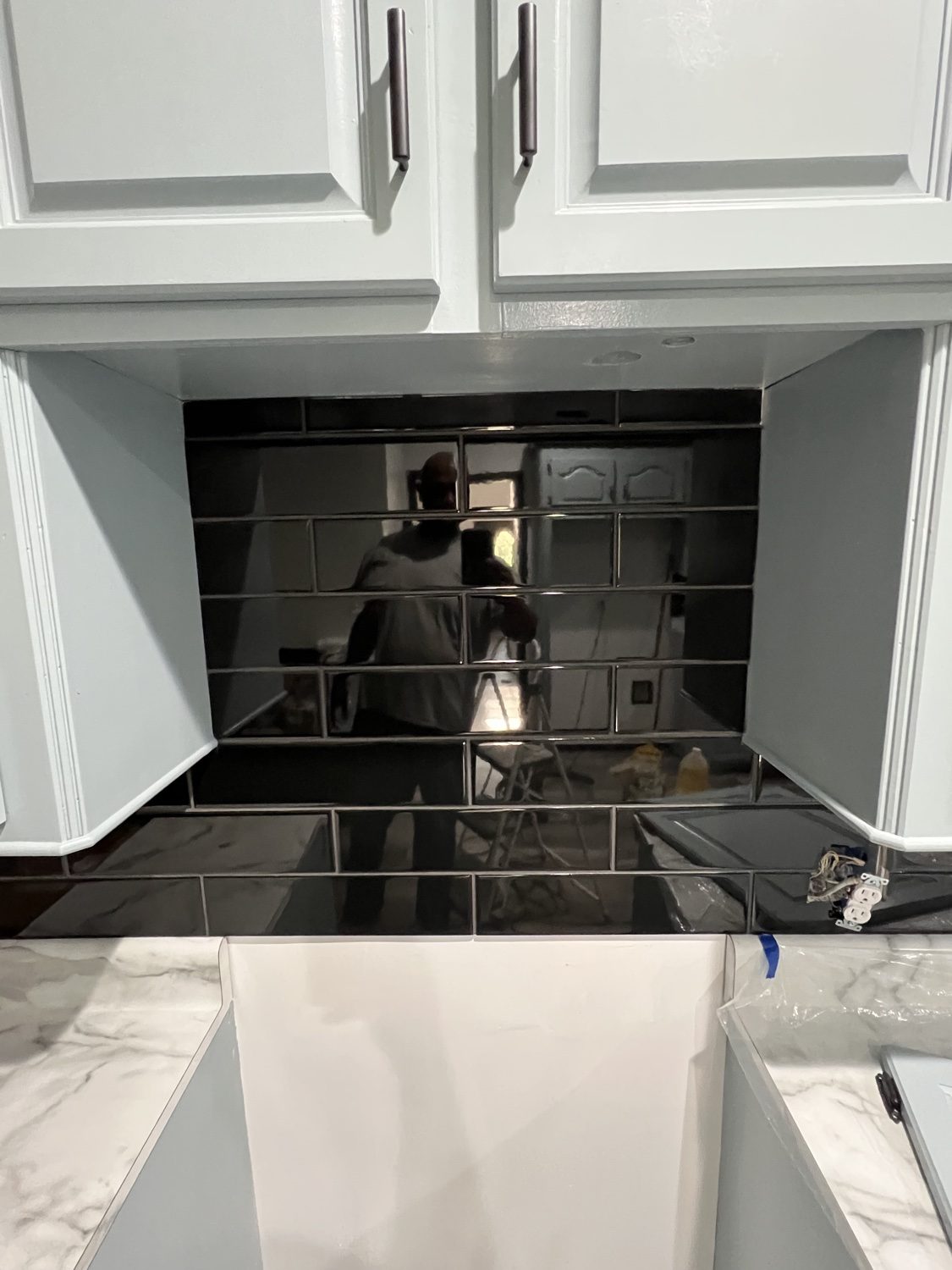 Finished kitchen with new black subway-tile backsplash