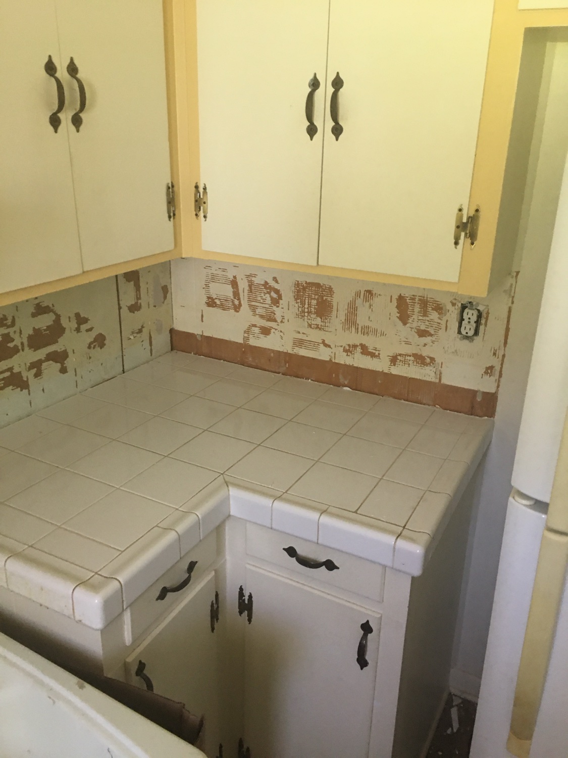 Kitchen renovation in progress with new countertops installed