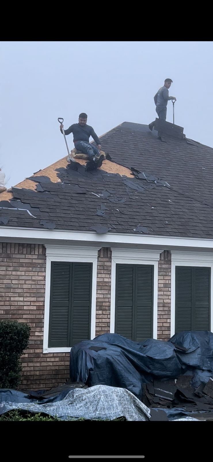 Roof tarping after storm damage